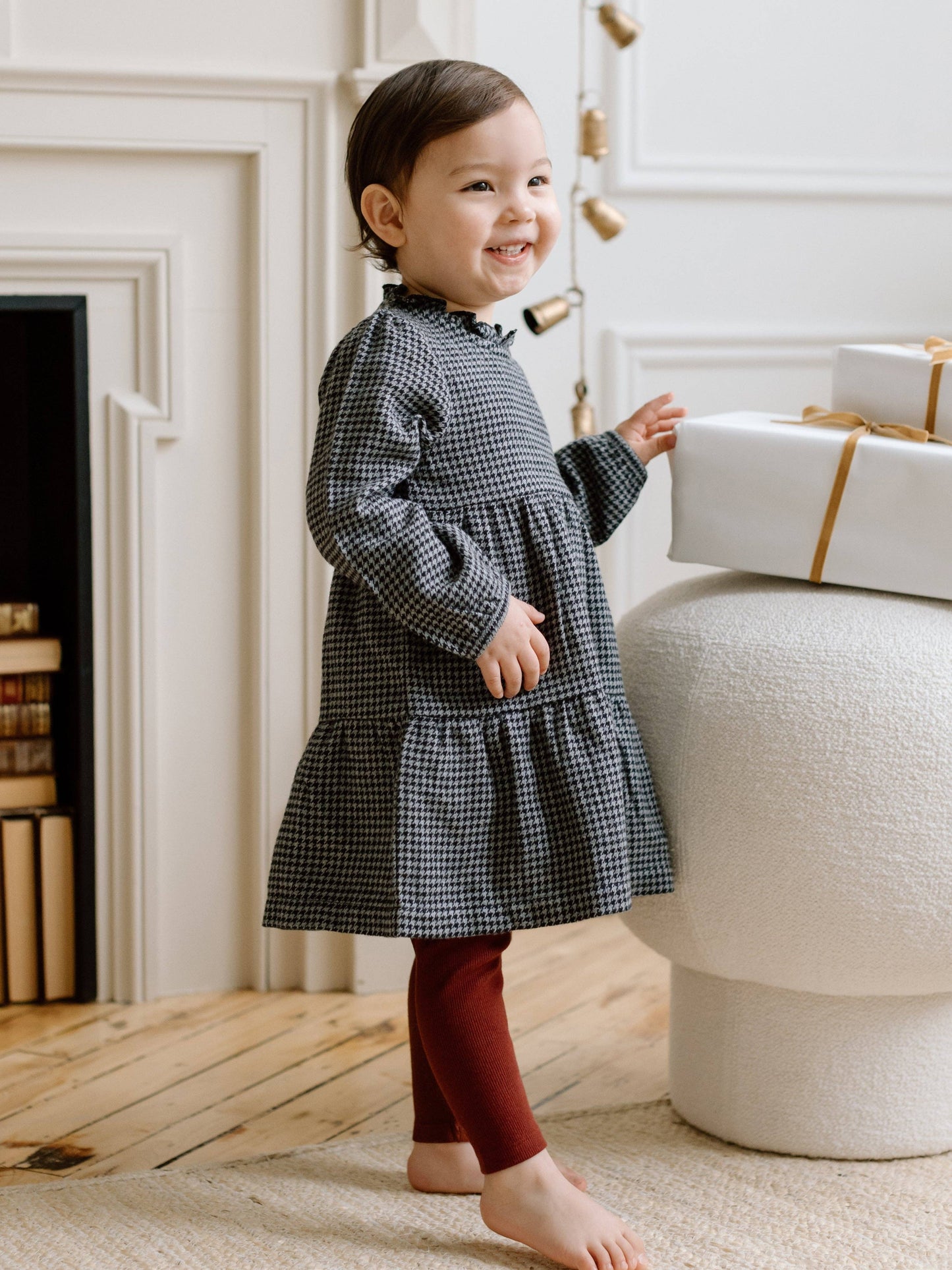 Side view of Neela Flannel Dress by Colored Organics, highlighting ruffle neckline, gathered sleeve cap, and cozy organic flannel fabric