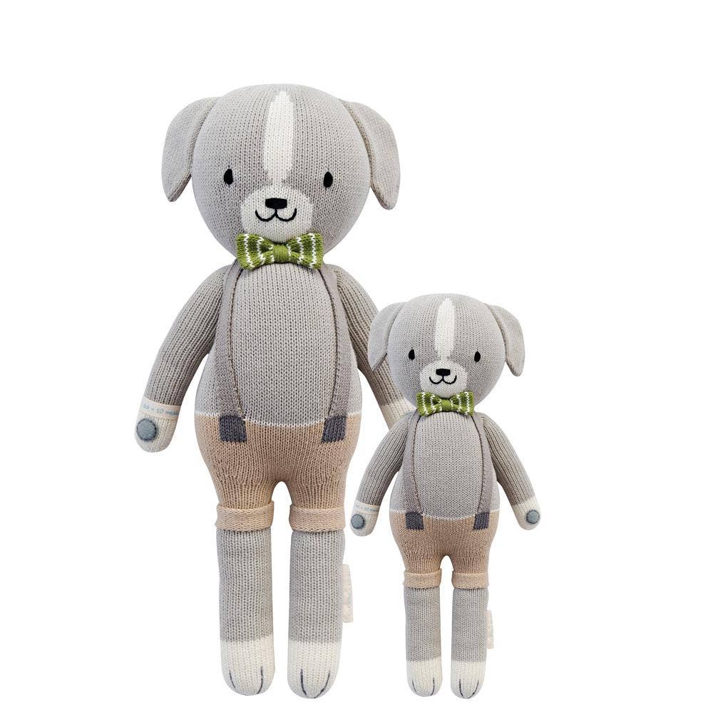 Flatlay of Noah the Dog hand-knit dolls in regular and little sizes shown from the front, made from 100% cotton yarn.
