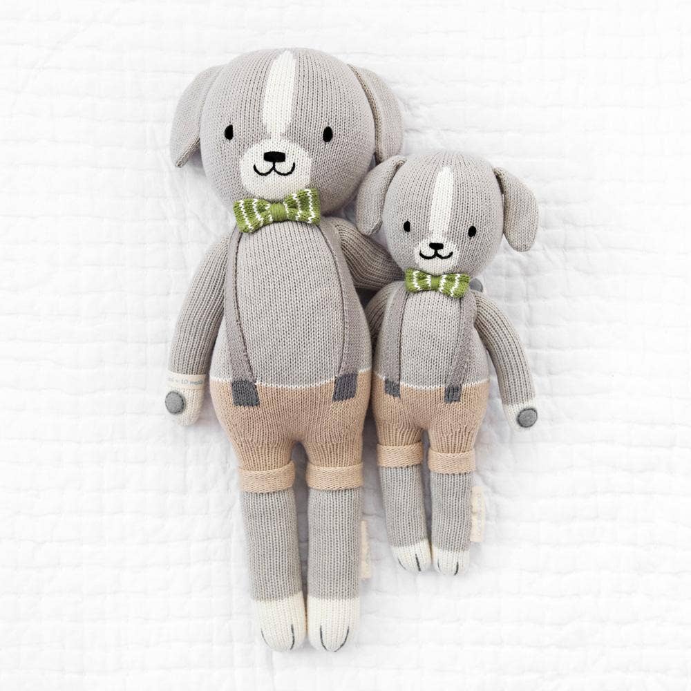 
                      
                        Styled flatlay of Noah the Dog heirloom dolls in regular and little sizes, designed for newborns, toddlers, and young children.
                      
                    