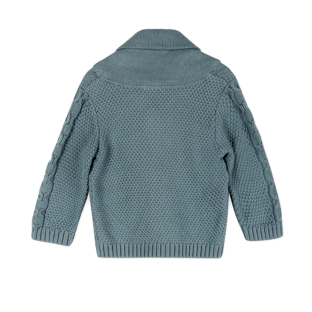 
                      
                        Flatlay back view of Viverano Organic Cotton Baby Cardigan featuring classic cable knit and shawl collar
                      
                    