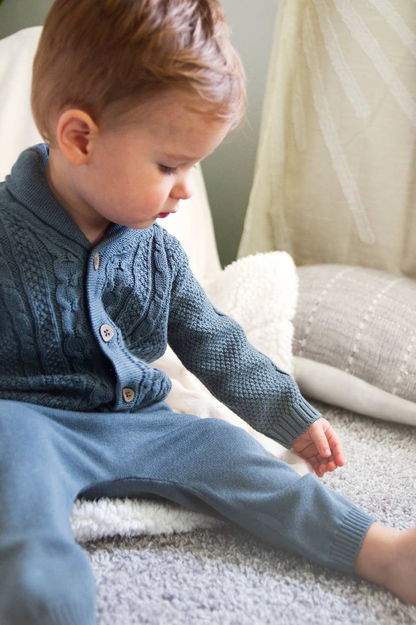 Baby boy wearing Viverano Organic Cotton Cable Knit Cardigan with matching joggers, styled cozy and casual