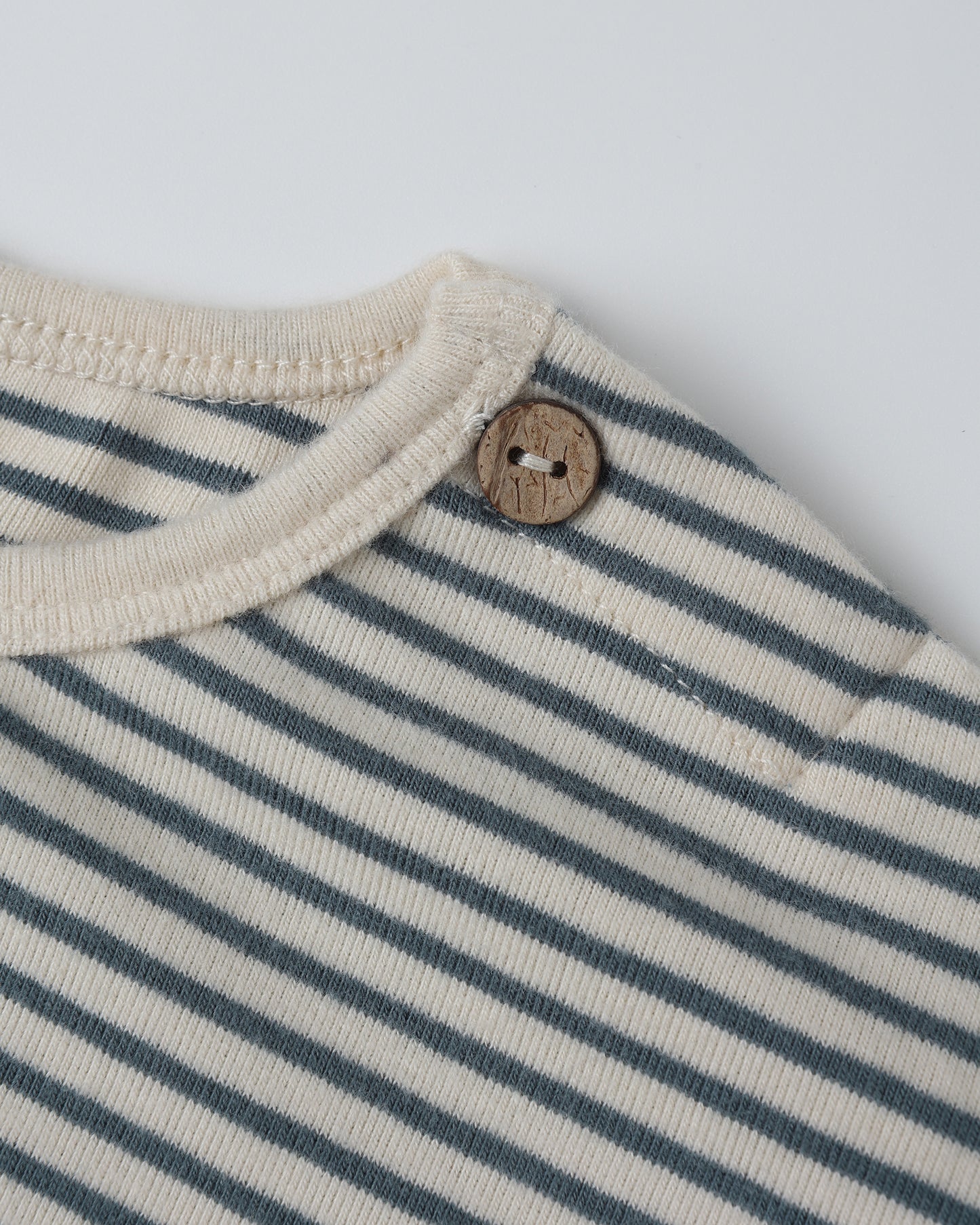 Close-up of fabric and micro stripe detail on the Organic Long Sleeve Tee by Quincy Mae.