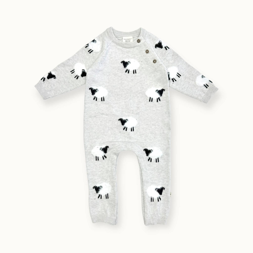 Flatlay of Viverano Organic Cotton Sheep Baby Jumpsuit in soft sweater knit with jacquard and appliqué details