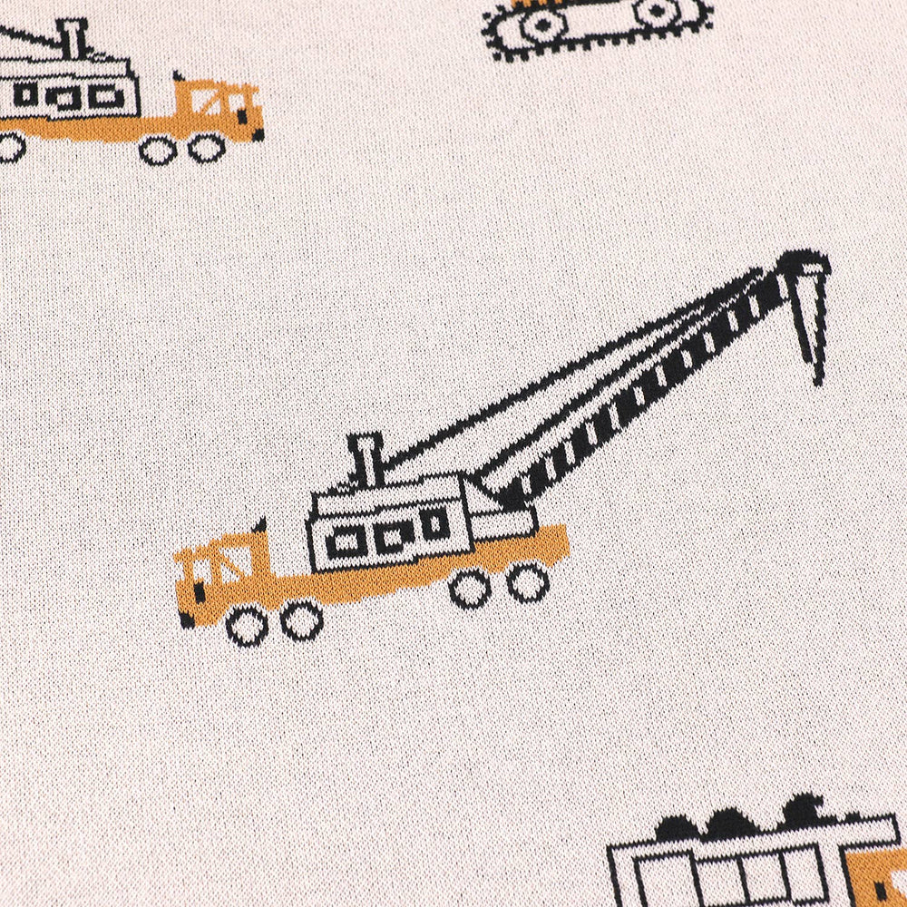 
                      
                        Close-up of detailed truck jacquard knit design on Viverano Organic Cotton Baby Blanket
                      
                    