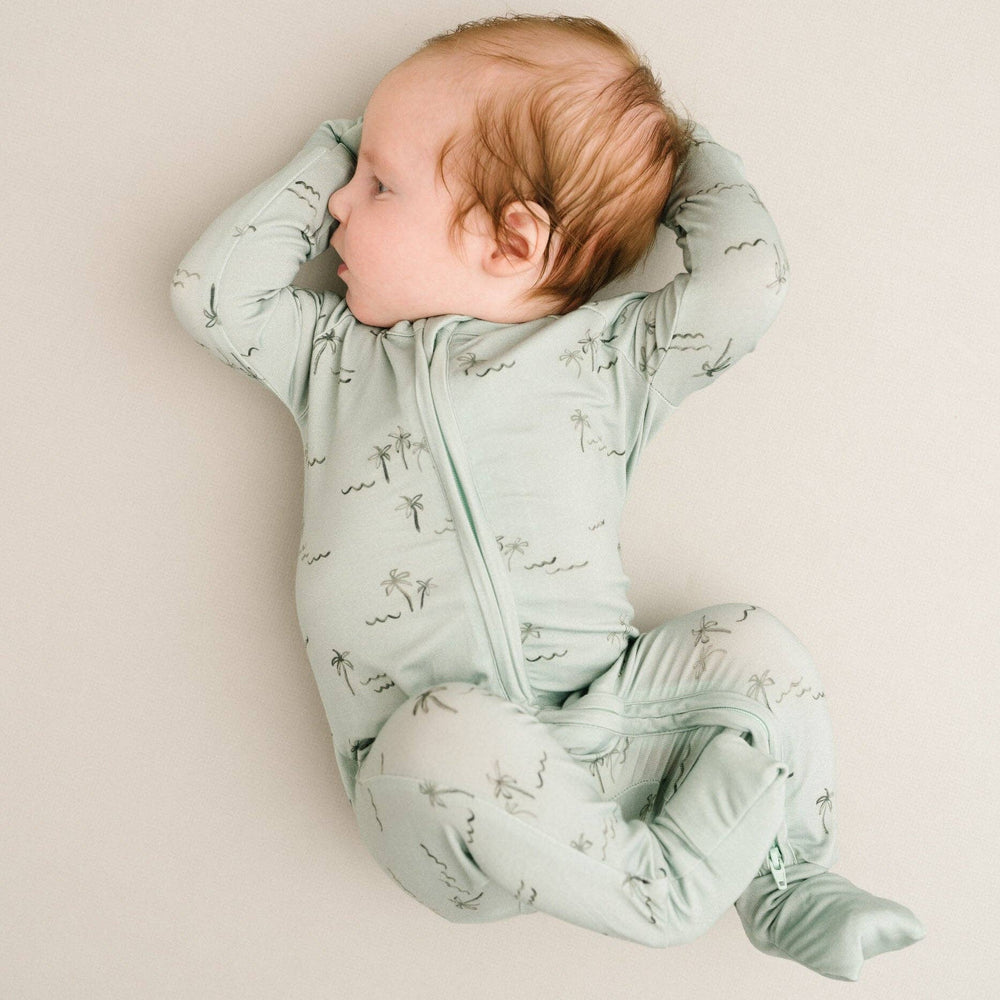 
                      
                        Baby in crib wearing Palm Breeze Bamboo Sleeper with fold-over footies down, highlighting full foot coverage option.
                      
                    