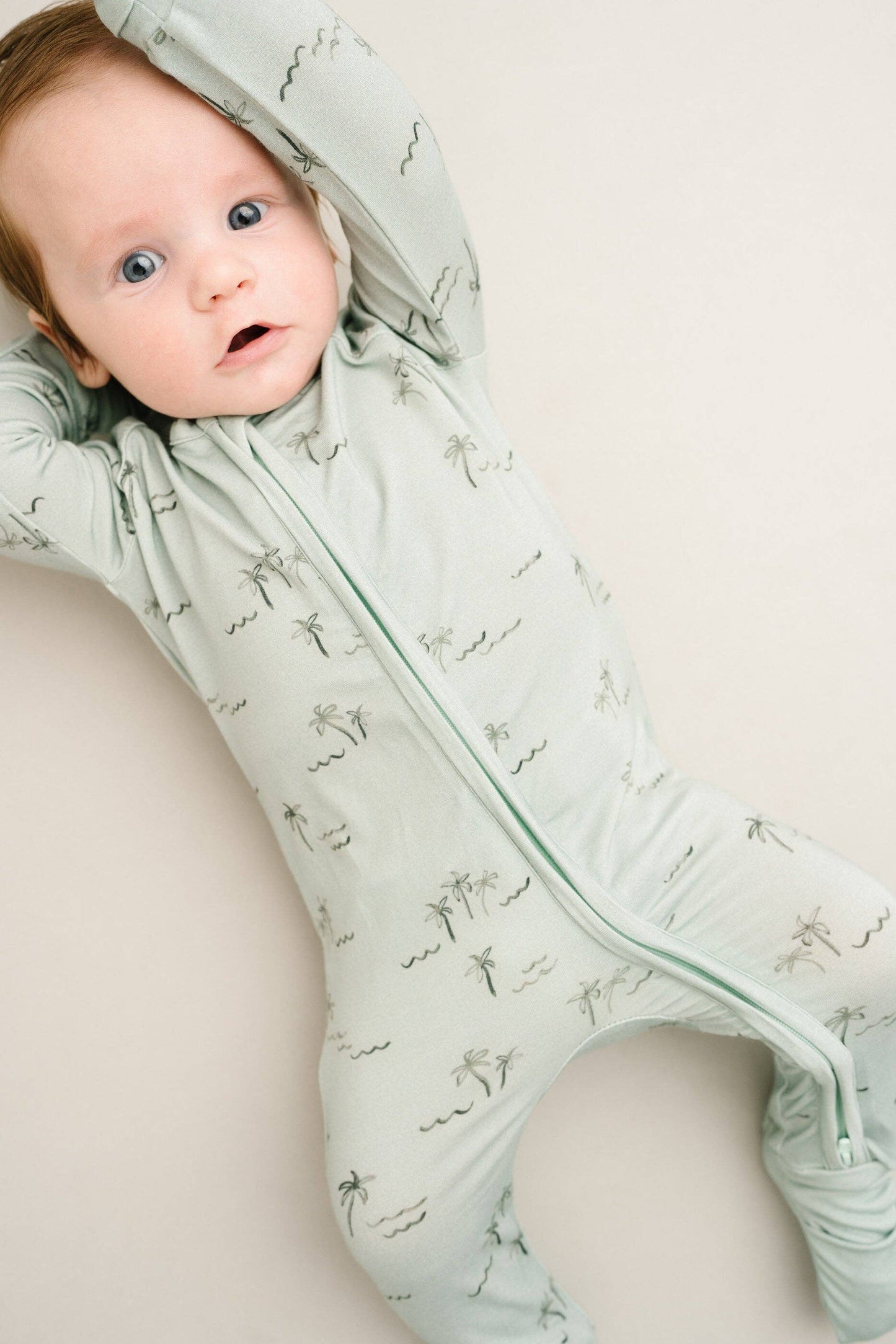 Detailed view of Palm Breeze Bamboo Sleeper zipper and neckline, highlighting quality stitching and smooth finish.