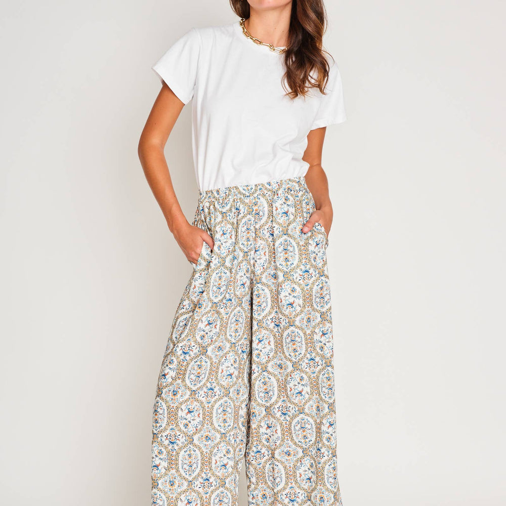 Front view of model wearing Paloma Wide Leg Pant in Santorini Mosaic print with a simple top, showing relaxed, flattering silhouette