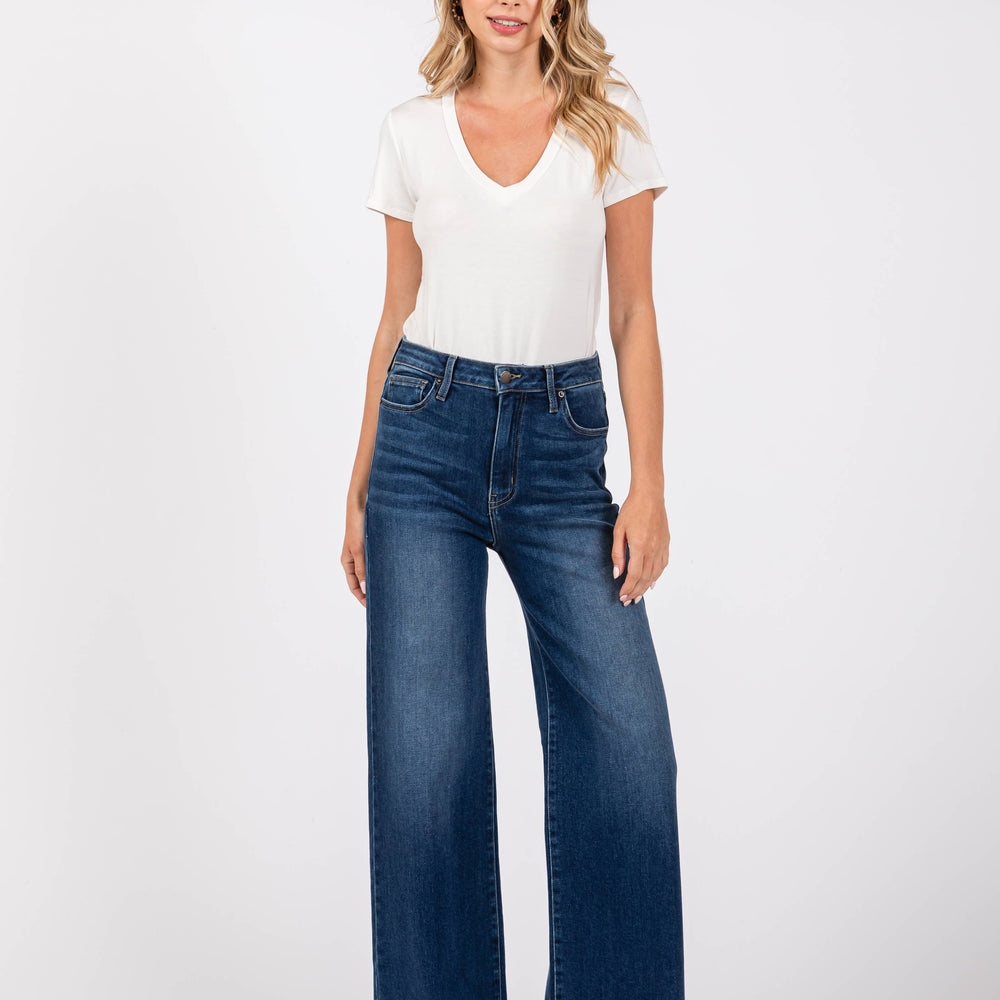 Model wearing Pipa High Rise Superwide Jeans in dark wash styled with a basic white tee. Full-length wide leg denim made in the USA.