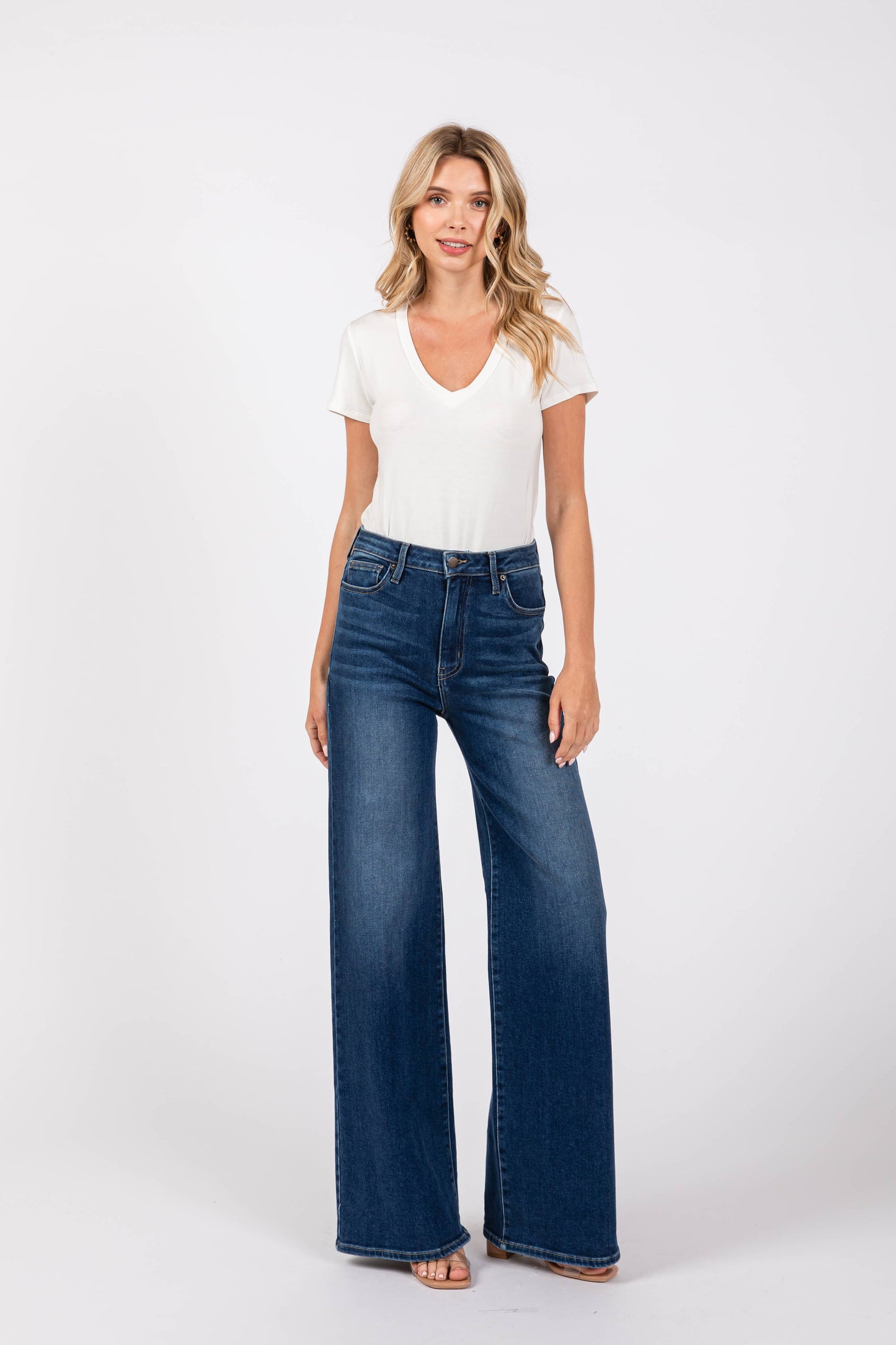 Model wearing Pipa High Rise Superwide Jeans in dark wash styled with a basic white tee. Full-length wide leg denim made in the USA.