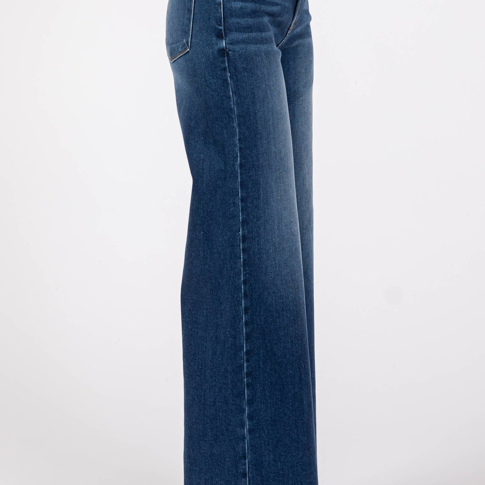 
                      
                        Side profile of model wearing Pipa High Rise Superwide Jeans, highlighting the dramatic wide leg silhouette and flattering high rise fit.
                      
                    