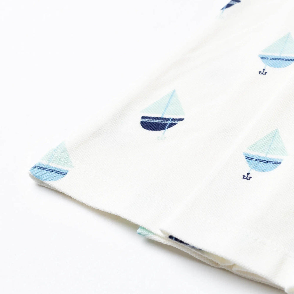 
                      
                        Close-up of the soft pleated skirt on Anchor Down tennis dress, showing movement and texture
                      
                    