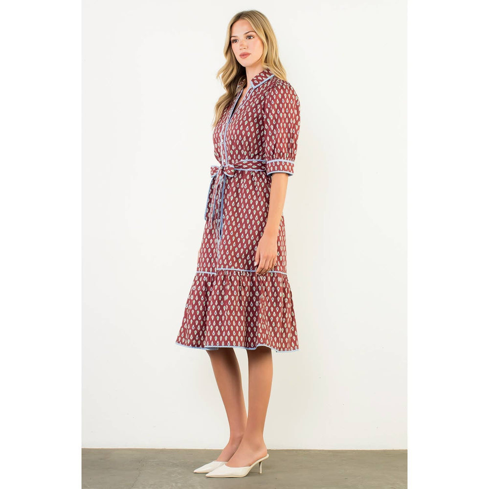 
                      
                        Side profile highlighting puff sleeve design and flowing midi length
                      
                    