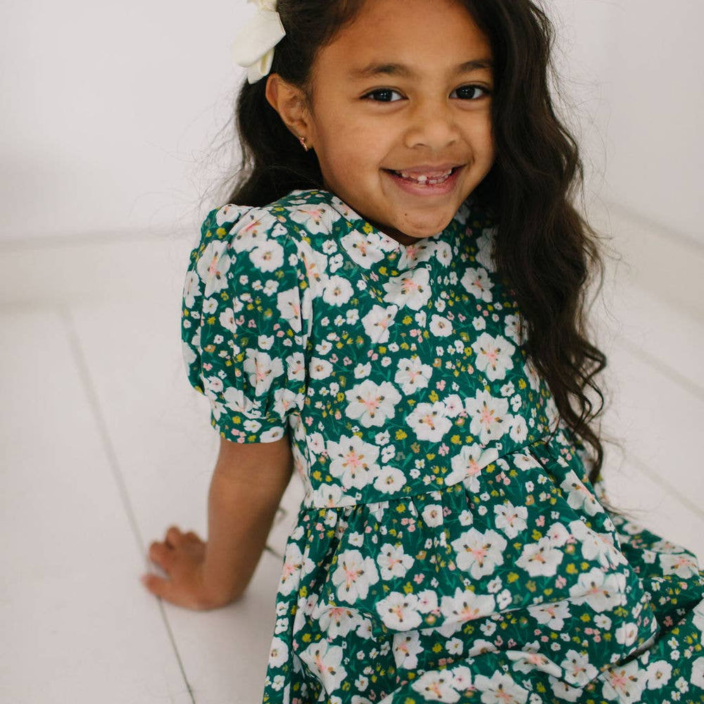 
                      
                        Close-up of the puff sleeve romper’s fabric and puff sleeve detail, made from soft and stretchy cotton blend.
                      
                    
