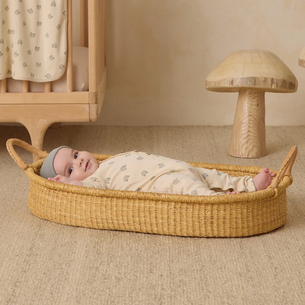 
                      
                        Baby wearing Quincy Mae long sleeve bears jumpsuit, laying in bassinet, highlighting soft organic cotton design.
                      
                    