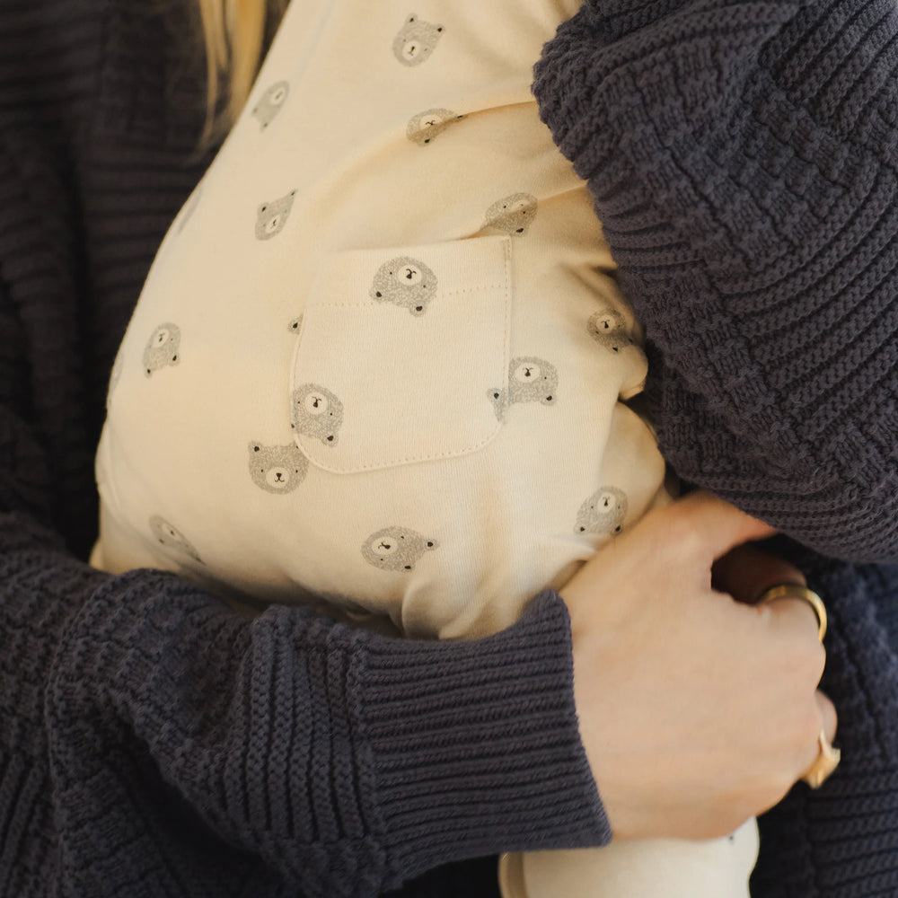 
                      
                        Close-up of back pocket detail on Quincy Mae organic cotton bears jumpsuit, showing thoughtful design and durability.
                      
                    