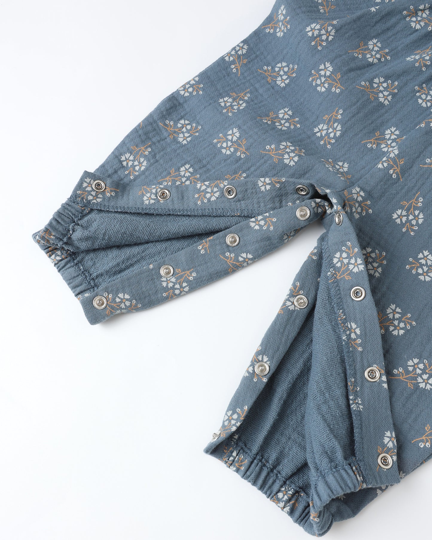 Close-up of blue floral print and adjustable strap detail on Quincy Mae Maisie Overall with coordinating bloomers.