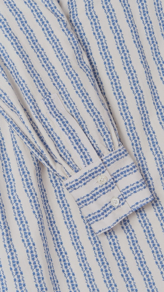 
                      
                        Close-up view of the floral stripe print on the Sable Dress by Ivy Coast Collection, showcasing soft cotton texture and sun-safe style.
                      
                    