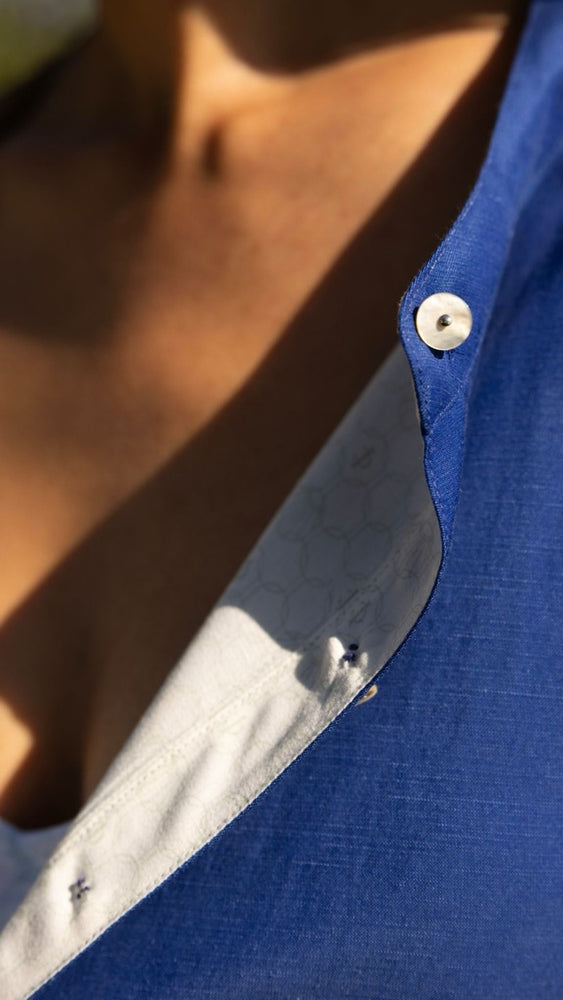 
                      
                        Close-up of mandarin collar and Akoya shell buttons on Savannah Dress – elegant and sustainable details
                      
                    