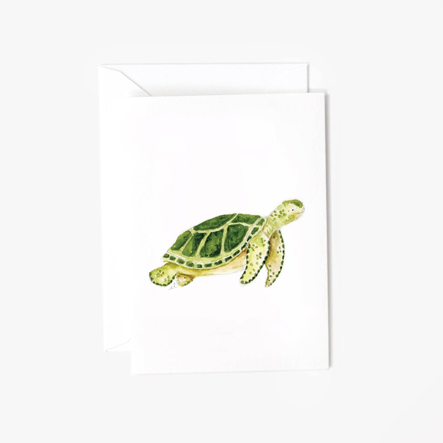 Flatlay of the Sea Turtle Mini Notecard by Emily Lex, featuring a hand-painted watercolor sea turtle on a small white card with matching envelope, ideal for gift enclosures or petite greetings.