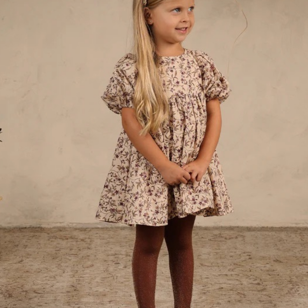 
                      
                        Toddler wearing Noralee Shimmer Tights in Fig, styled with a cozy autumn outfit for a special occasion.
                      
                    