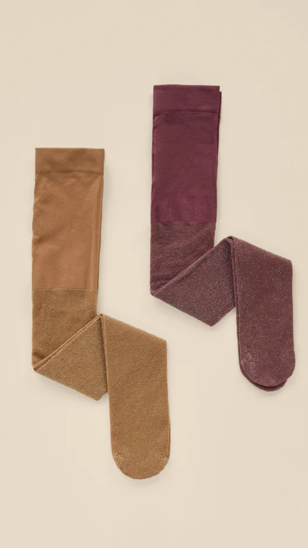 Flat lay of Noralee Shimmer Tights in rich Golden and Fig, showcasing subtle sparkle and elegant fall colors.