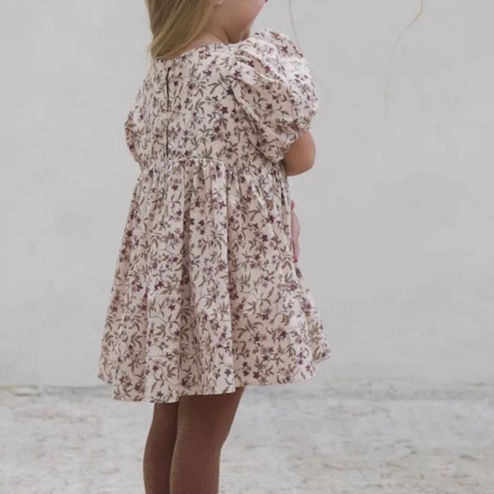 
                      
                        Back view of toddler in Noralee Shimmer Tights in Golden & Fig, highlighting the flattering fit and shimmering texture.
                      
                    