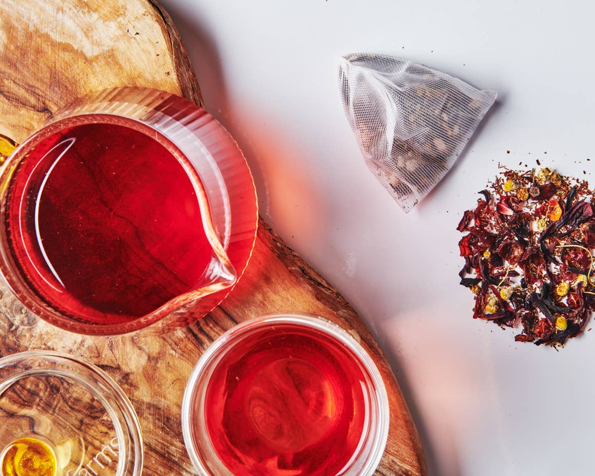 Biodegradable sachet of Shine tea featuring antioxidant-rich rooibos, hibiscus, and rosehips