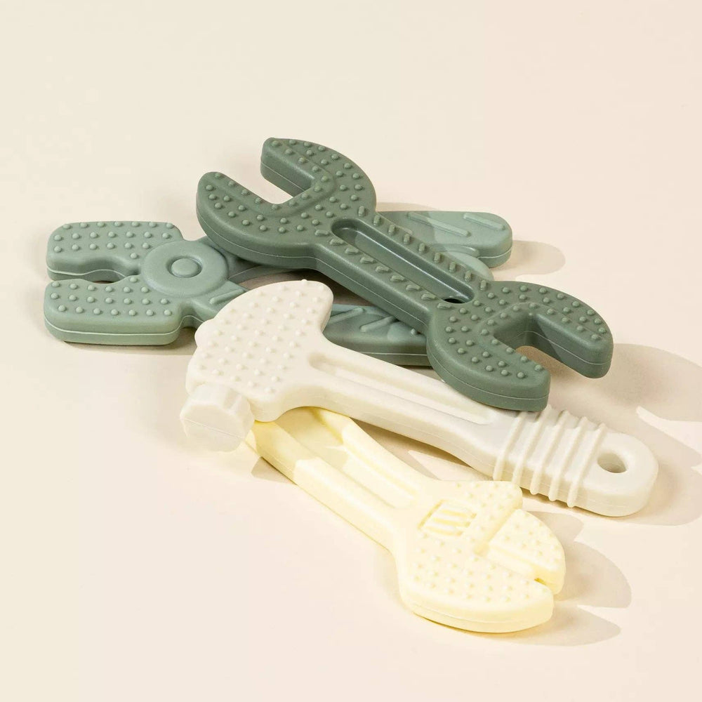 
                      
                        Overhead flatlay of a pair of textured silicone baby tools, crafted for hand-eye coordination and motor development.
                      
                    