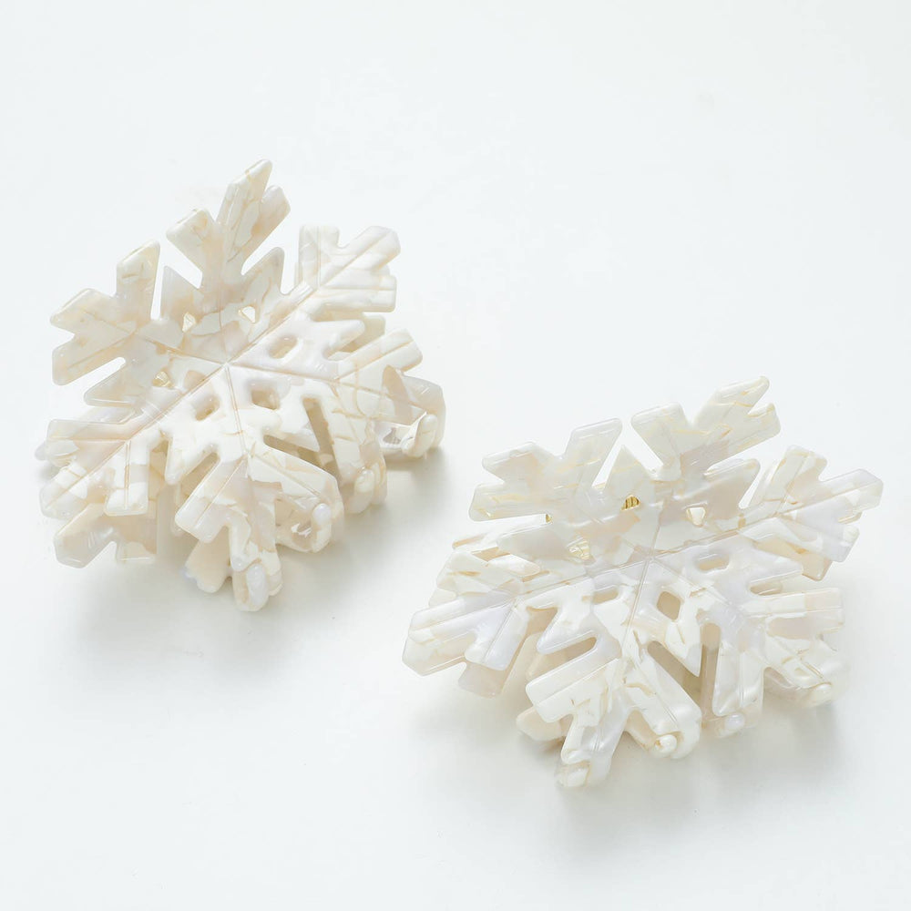 
                      
                        Two Snowflake Medium claw clips flatlay view showcasing Snowfall print, eco-friendly cellulose acetate, and medium size for versatile hairstyles
                      
                    