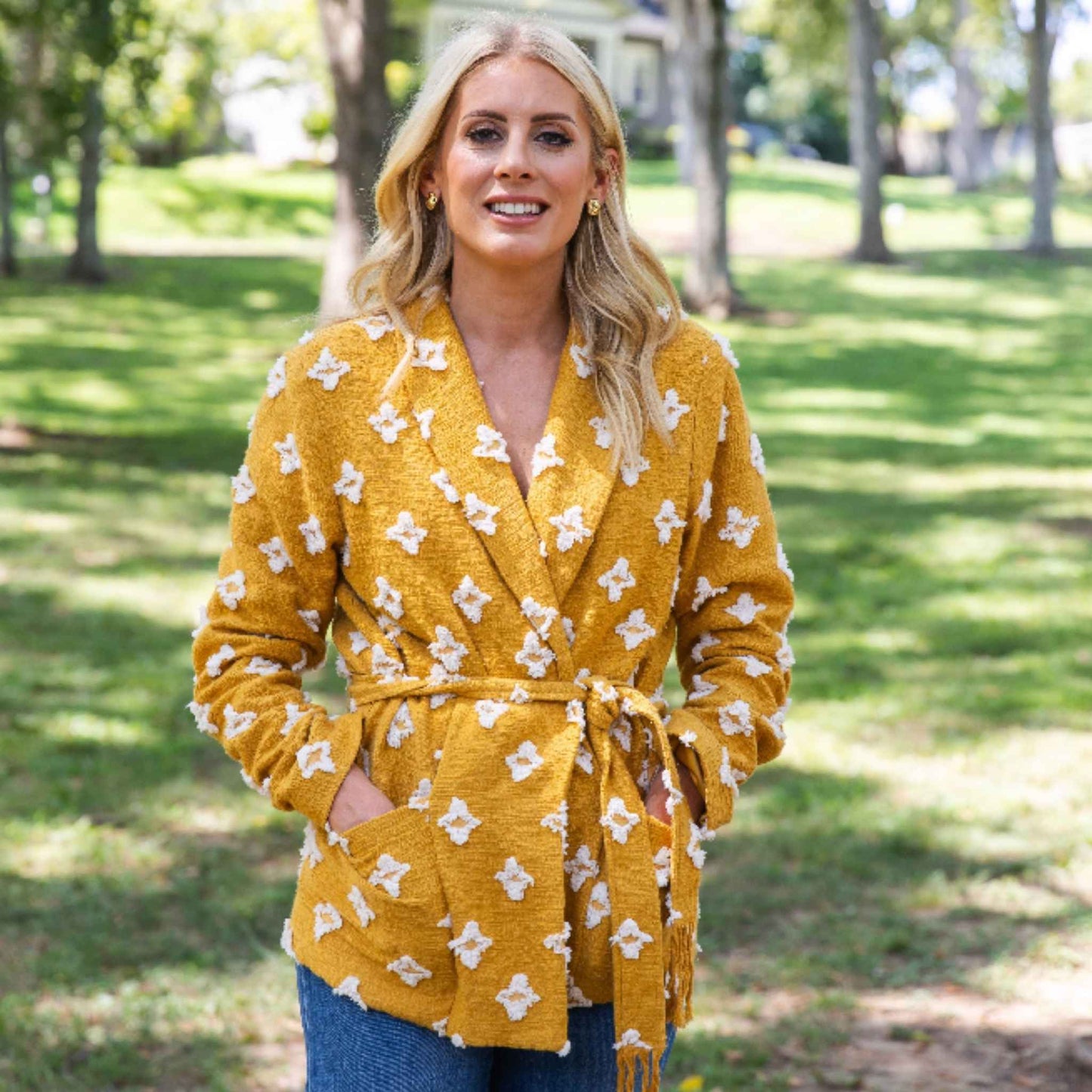 Belted styling highlighting tassel belt detail