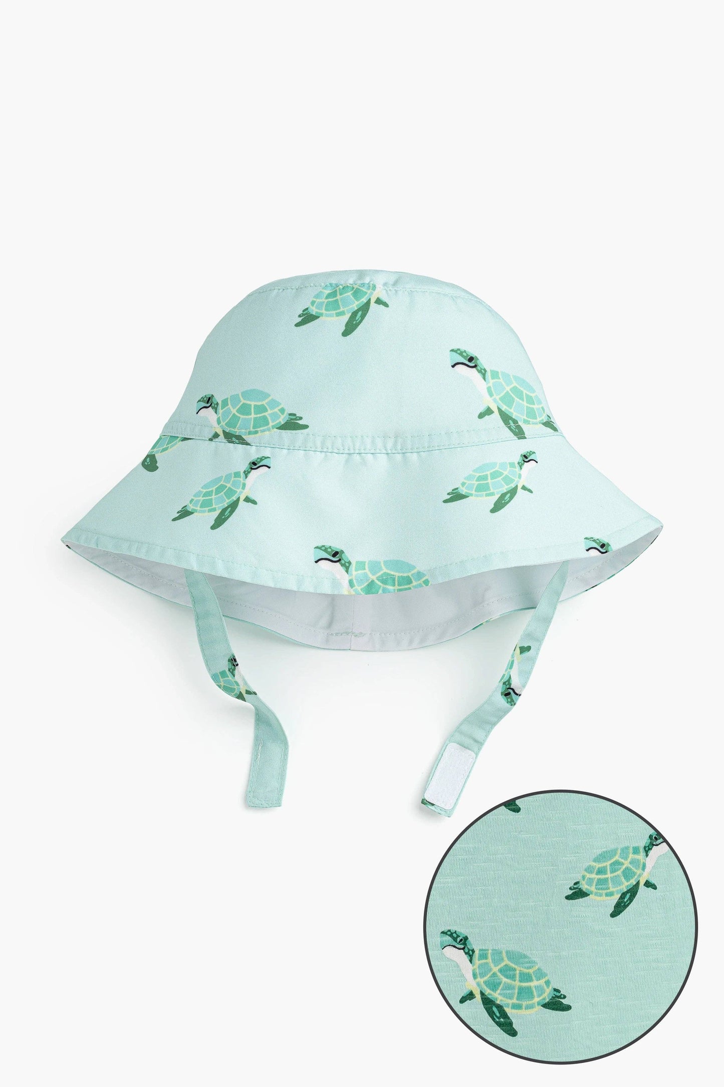 Flat lay of Sea Turtles sun hat with close-up of cheerful sea turtle print on recycled polyester