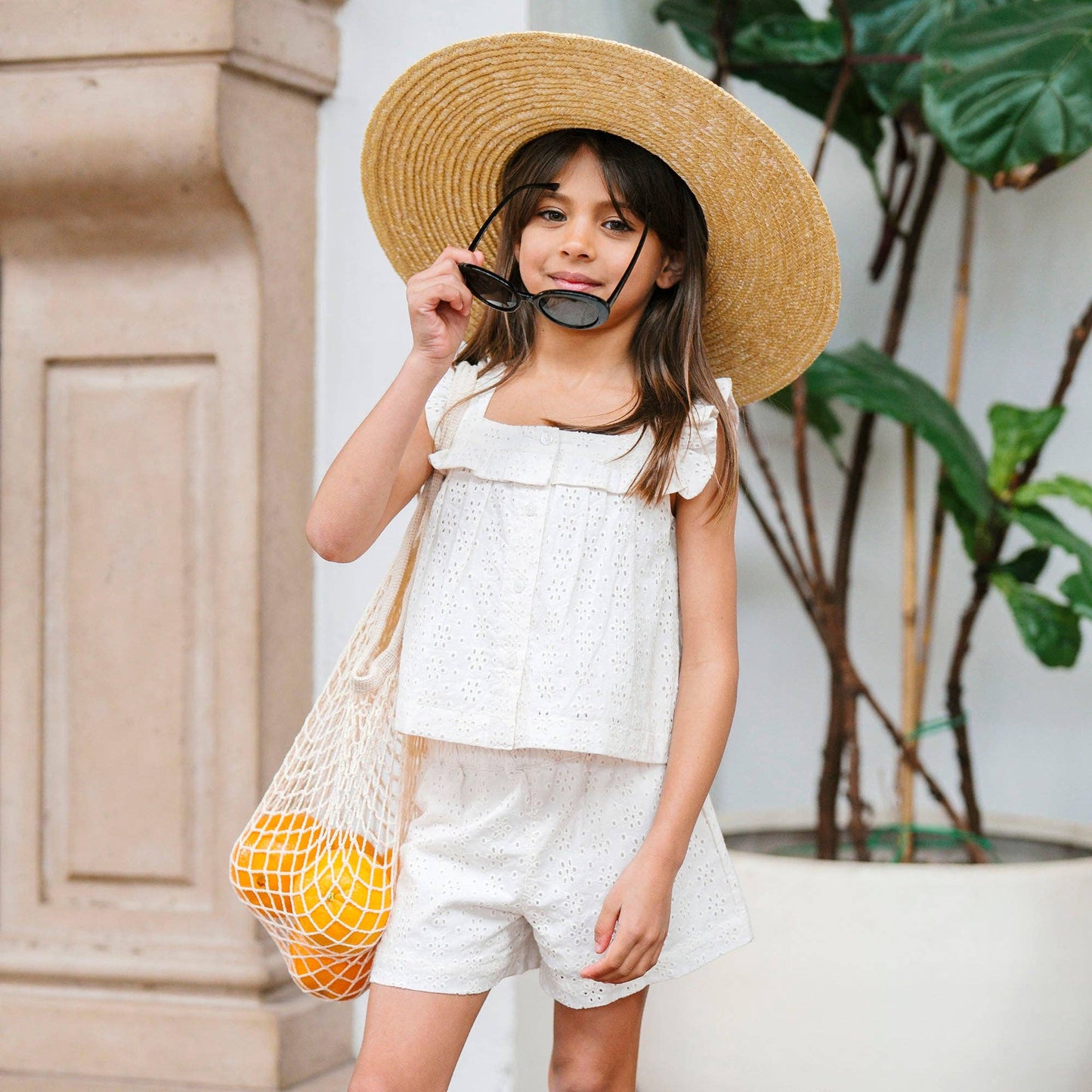 Girl wearing Organic Eyelet Tank & Pull-On Short in ivory GOTS-certified cotton — Grace & Haven, Essex CT
