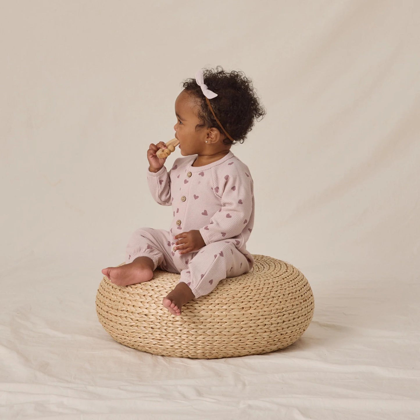 Waffle long sleeve jumpsuit with hearts print by Quincy Mae, organic cotton baby one-piece