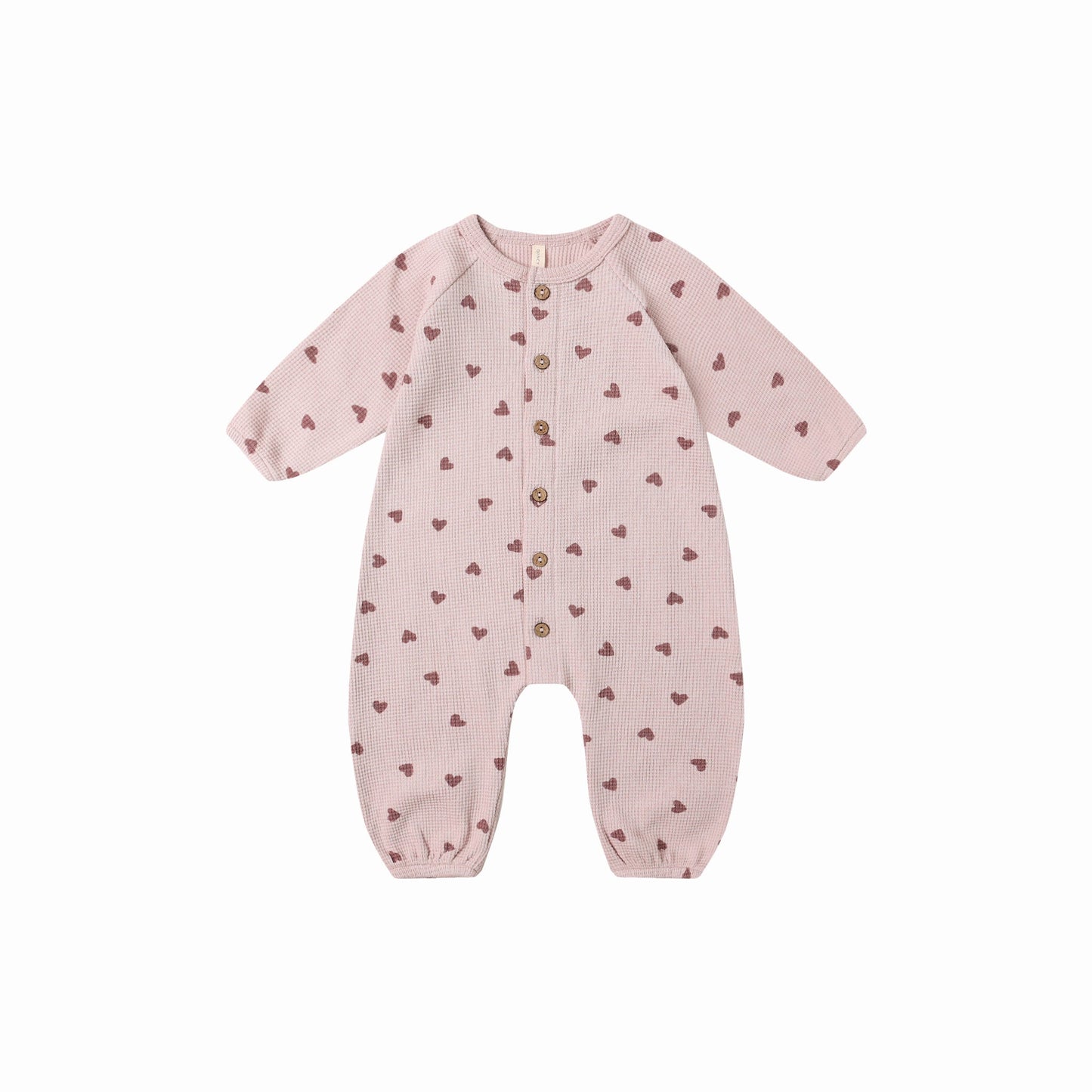 Front view of the Hearts Waffle Long Sleeve Jumpsuit by Quincy Mae, soft organic cotton for babies.