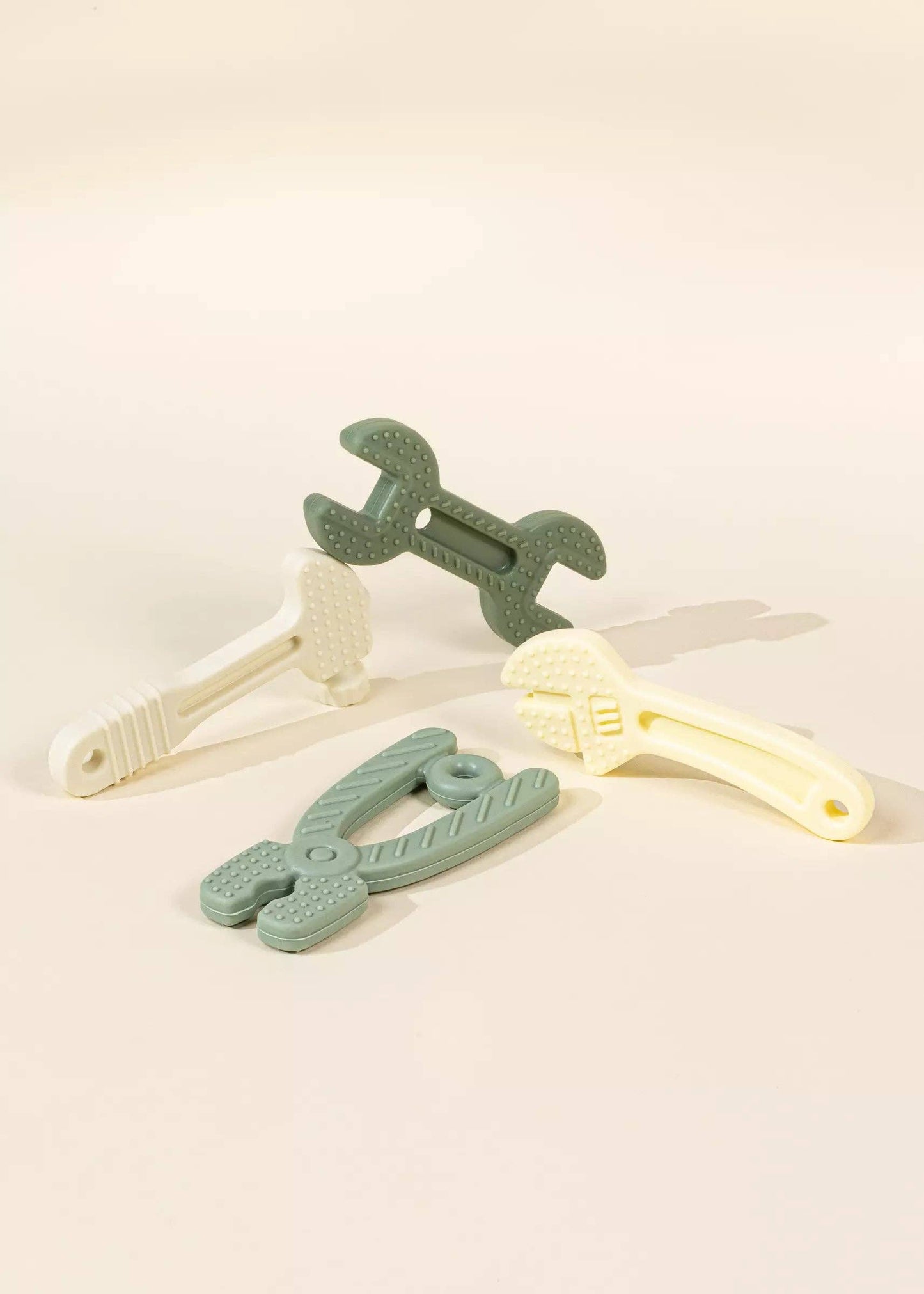 Set of 4 Silicone Tools Baby Teethers & Toys – a set of safe, durable silicone teethers designed for babies, perfect for soothing gums and encouraging sensory play. These versatile toys come in fun shapes and are gentle on little teeth, ideal for teething relief and early development.