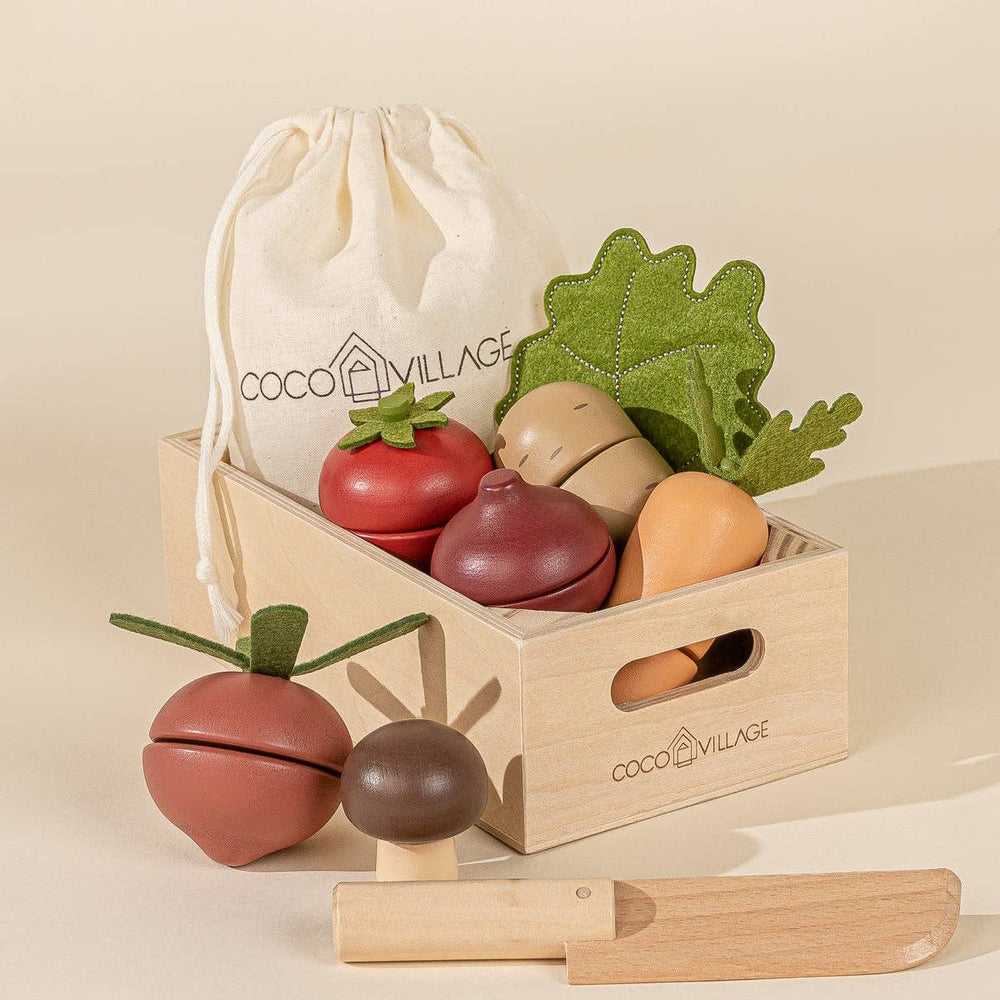 Wooden Vegetables Playset by Coco Village. This colorful, eco-friendly playset features a variety of wooden vegetables, including carrots, tomatoes, and cucumbers, designed for imaginative play. Perfect for young children, the set encourages healthy habits and learning about food in a fun, interactive way. Made from sustainable materials, this charming toy is safe and durable, offering endless opportunities for pretend cooking and role-playing. Ideal for nurturing creativity and fine motor skills in toddler