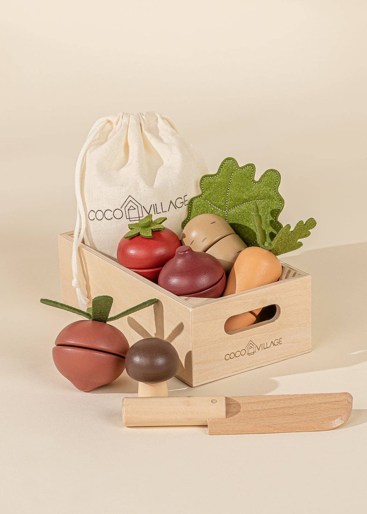 Wooden Vegetables Playset by Coco Village. This colorful, eco-friendly playset features a variety of wooden vegetables, including carrots, tomatoes, and cucumbers, designed for imaginative play. Perfect for young children, the set encourages healthy habits and learning about food in a fun, interactive way. Made from sustainable materials, this charming toy is safe and durable, offering endless opportunities for pretend cooking and role-playing. Ideal for nurturing creativity and fine motor skills in toddler